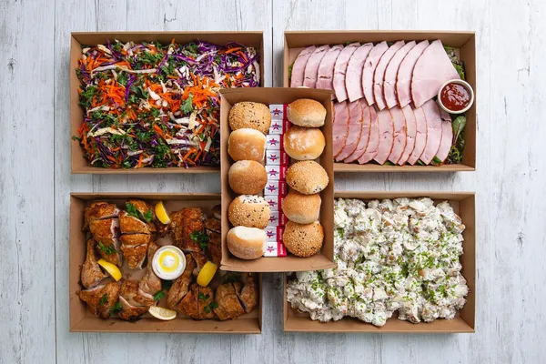 Delicious buffet catering spread with kebabs, roasted vegetables, and fresh salads at Glenny Kebabs.